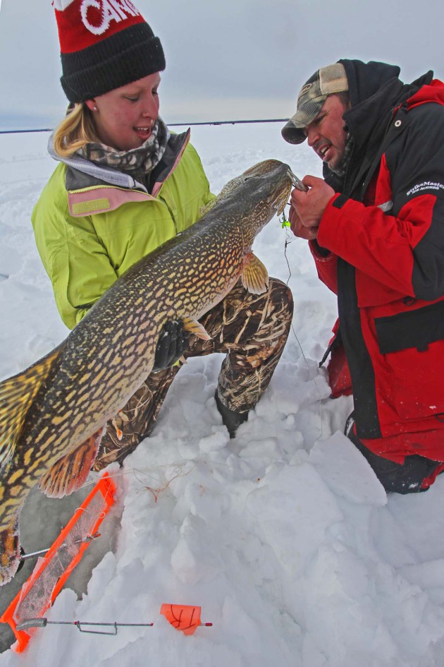 youth catching Northern Pike